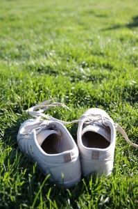 White sneakers in grass